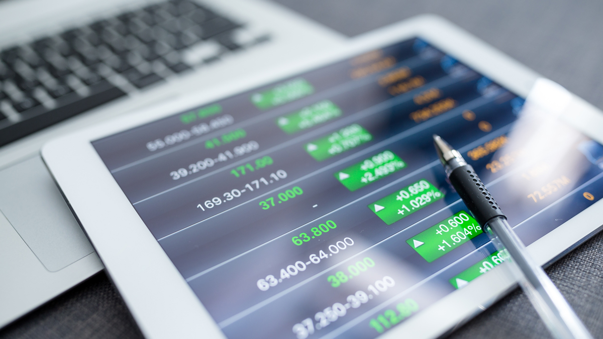 Close-up of tablet displaying financial graphs - Investors - AAK