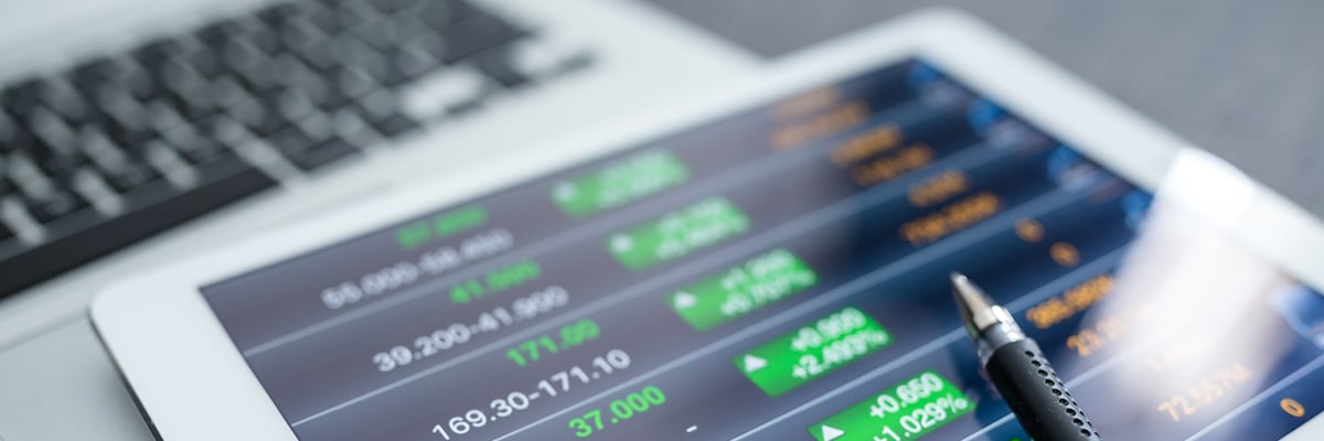 Close-up of tablet displaying financial graphs - Investors - AAK