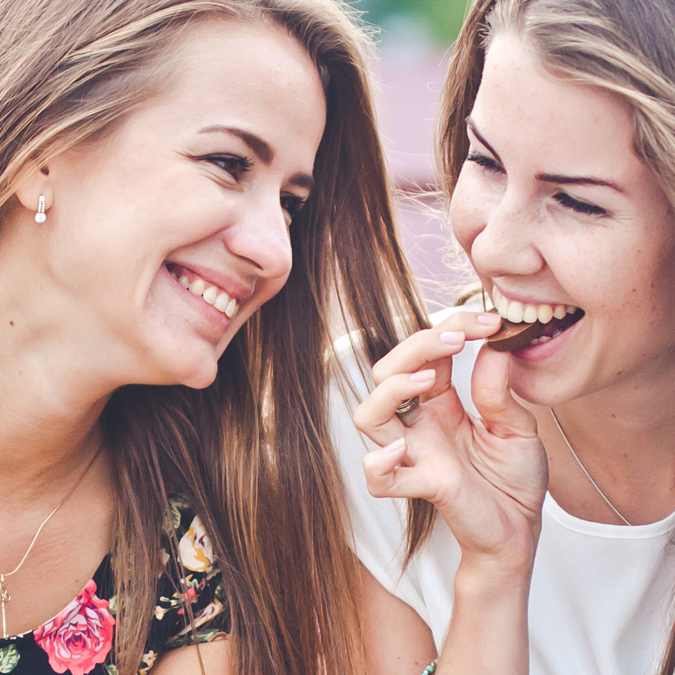 Smiling Women Eating Chocolate - Chocolate and Confectionery - AAK