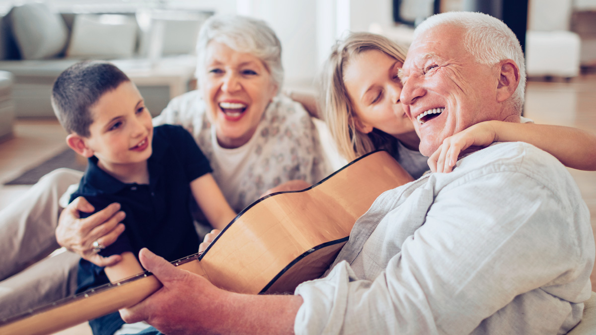 Older couple laughing together with boy and girl - Special Nutrition - AAK