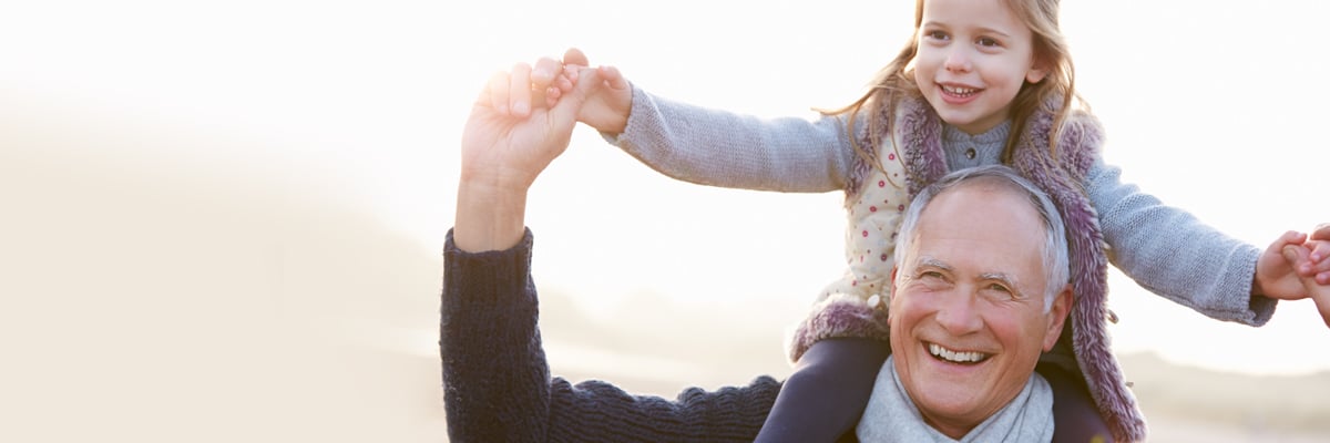 Happy girl sitting on old, laughing man's shoulders - Special Nutrition - AAK